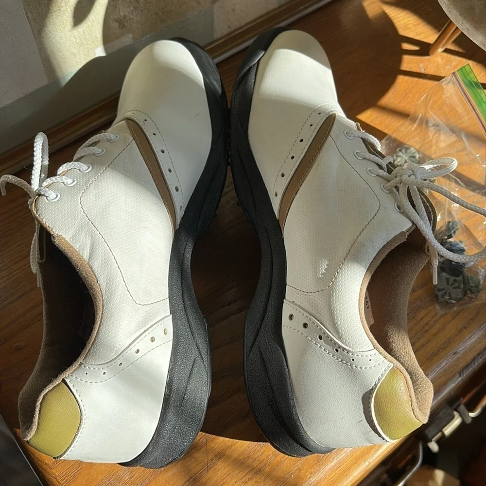 🎲 FootJoy GreenJoys 48762. Tan and white golf shoes.